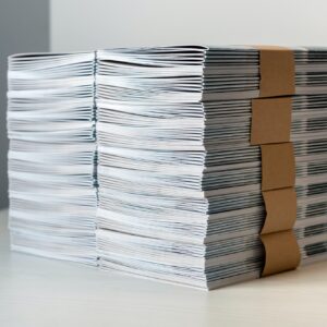 Bundles of newly printed catalogues in a stack