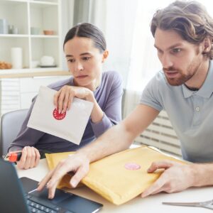 Couple checking their email