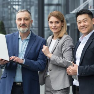 Portrait dream team IT specialists professionals team leaders outside office building looking at