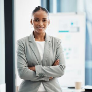 Professional, corporate businesswoman with arms crossed, in position of leadership, in marketing st