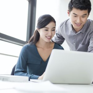 Young business person talking in office