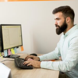 Young man working on pc computer