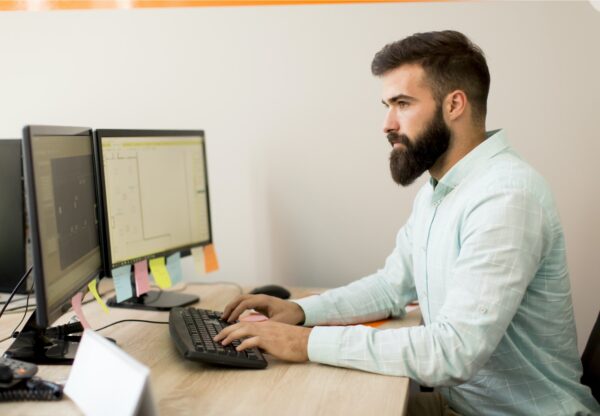 Young man working on pc computer