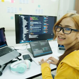 Young programmer or IT specialist satisfied with her work done.